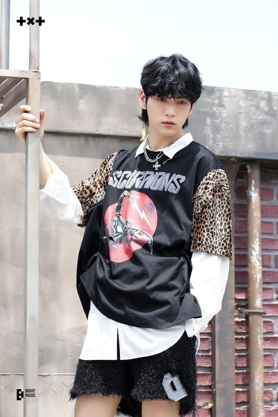Soobin of Tomorrow by Together posing in a Scorpions shirt, 